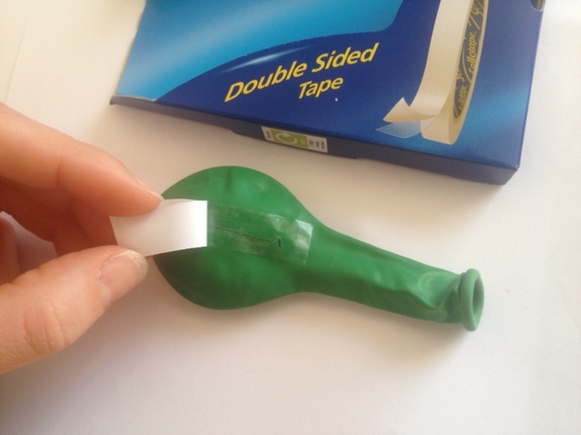 Using double-sided sticky tape, seal the incision.